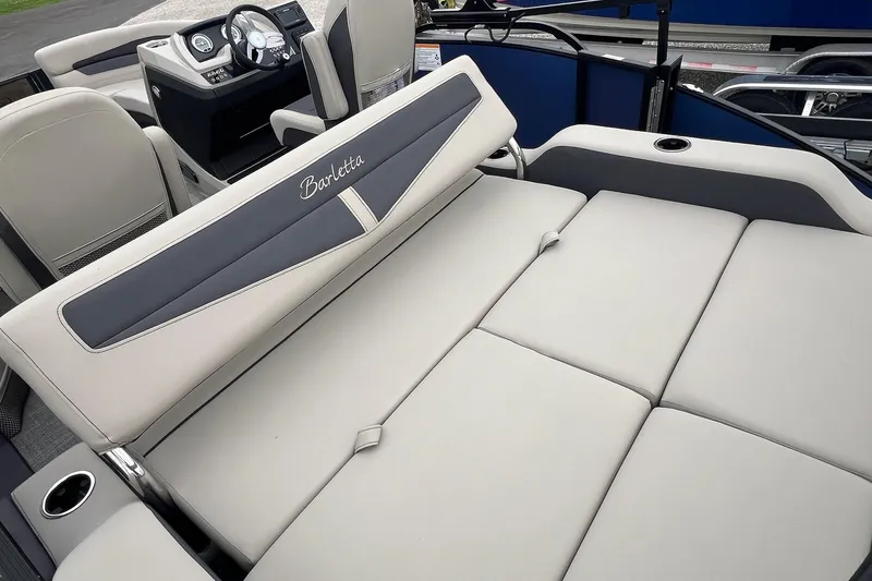 Slide: The Image of 2023 Barletta C22 boat interior with luxurious seating and modern dashboard. - 18
