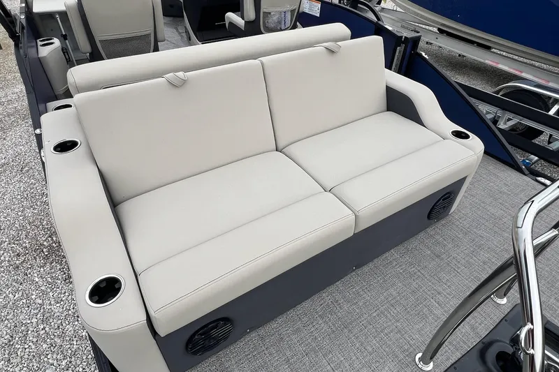 Slide: The Image of 2023 Barletta C22 boat interior with beige seating and cup holders. - 24