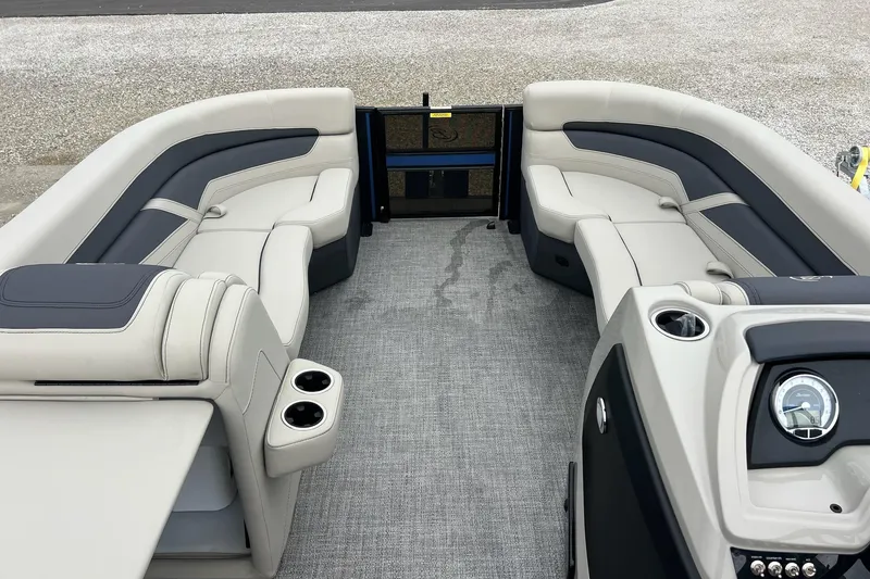 Slide: The Image of 2023 Barletta C22 pontoon boat interior with plush seating and modern dashboard. - 26
