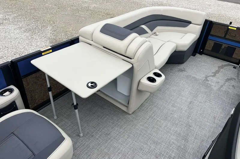 Slide: The Image of 2023 Barletta C22 pontoon boat interior with seating and table setup. - 27