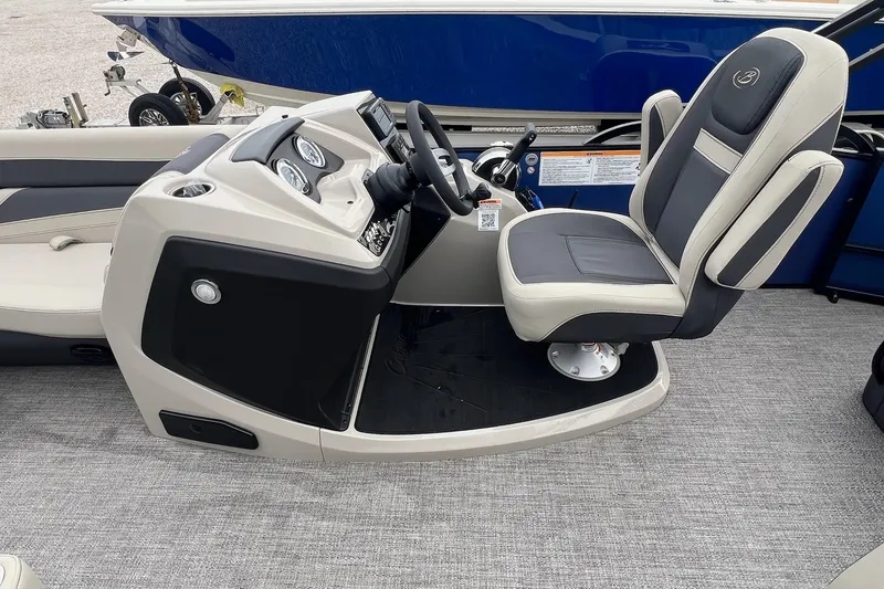Slide: The Image of 2023 Barletta C22 boat interior with steering console and captain's chair. - 28
