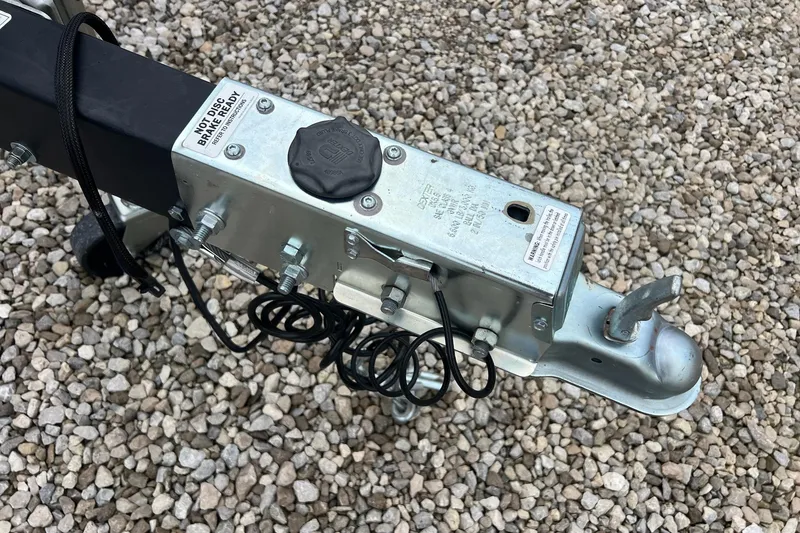 Slide: The Image of Trailer hitch of a 2023 Barletta C22 on gravel surface. - 3