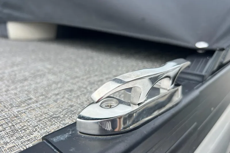 Slide: The Image of Close-up of a 2023 Barletta C22 boat cleat on textured flooring. - 7