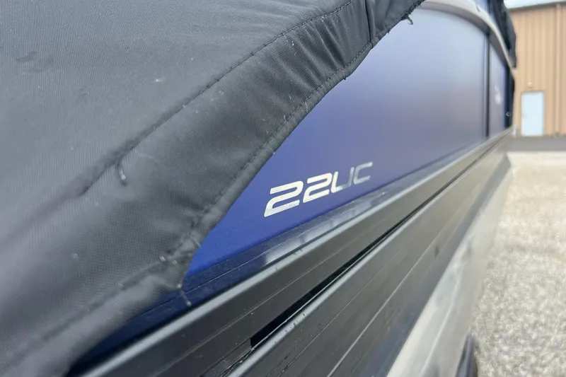 Slide: The Image of 2023 Barletta C22 boat with cover, featuring "22UC" model designation. - 8