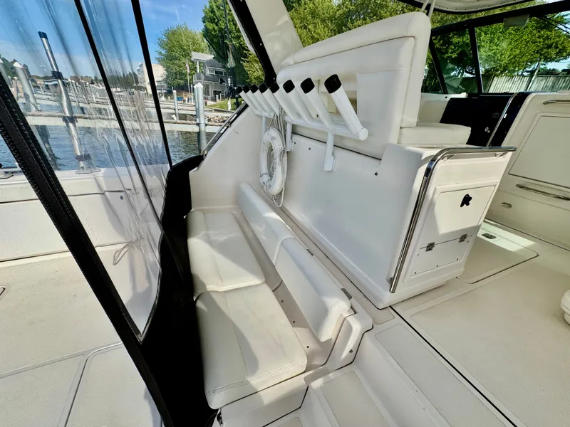 Slide: The Image of Interior of a 1999 Tiara Yachts 4100 Open with white seating. - 18