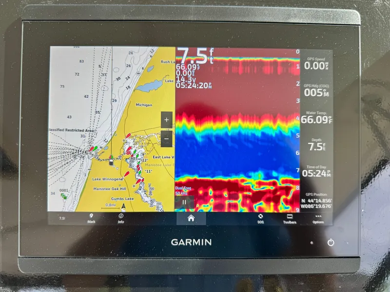 Slide: The Image of Garmin navigation system on 1999 Tiara Yachts 4100 Open displaying maps and sonar data. - 22