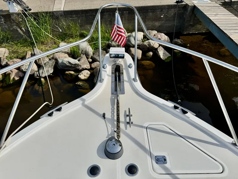 Slide: The Image of Foredeck of a 1999 Tiara Yachts 4100 Open with flag. - 32