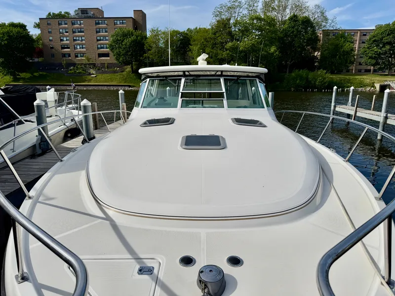 Slide: The Image of 1999 Tiara Yachts 4100 Open at dock, front view. - 34