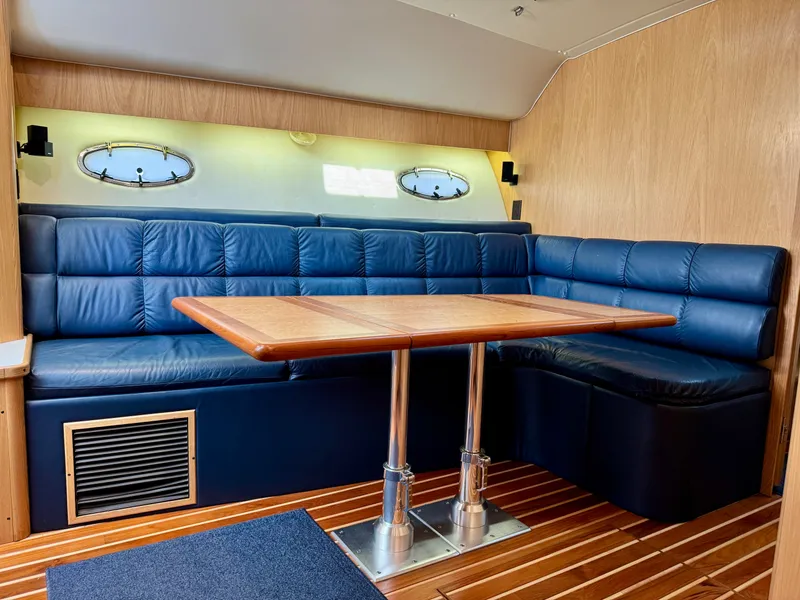 Slide: The Image of 1999 Tiara Yachts 4100 Open interior with blue leather seating. - 37