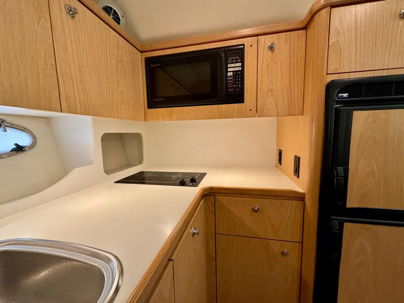 Slide: The Image of Interior of 1999 Tiara Yachts 4100 Open with kitchen. - 40