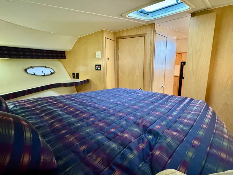 Slide: The Image of Interior of 1999 Tiara Yachts 4100 Open with cozy bed. - 42