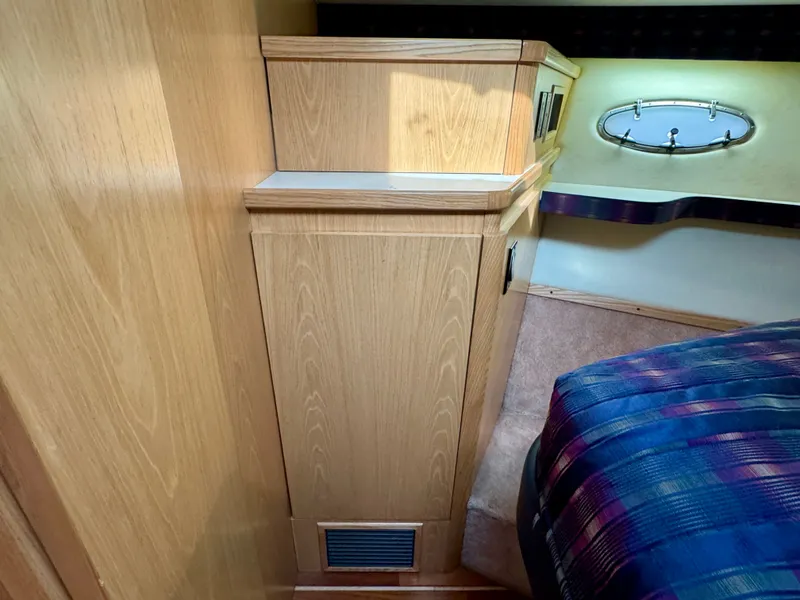 Slide: The Image of Interior of a 1999 Tiara Yachts 4100 Open with wooden cabinetry. - 43