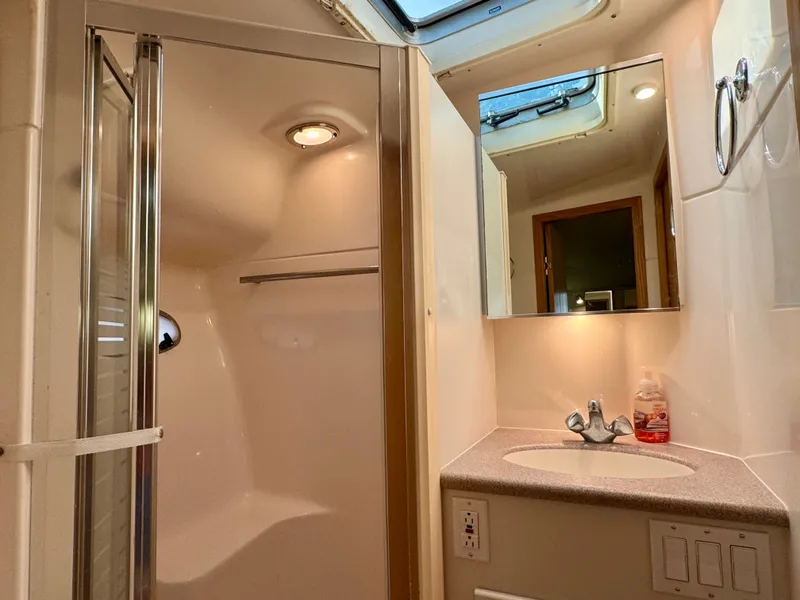 Slide: The Image of 1999 Tiara Yachts 4100 Open bathroom with shower and sink. - 44