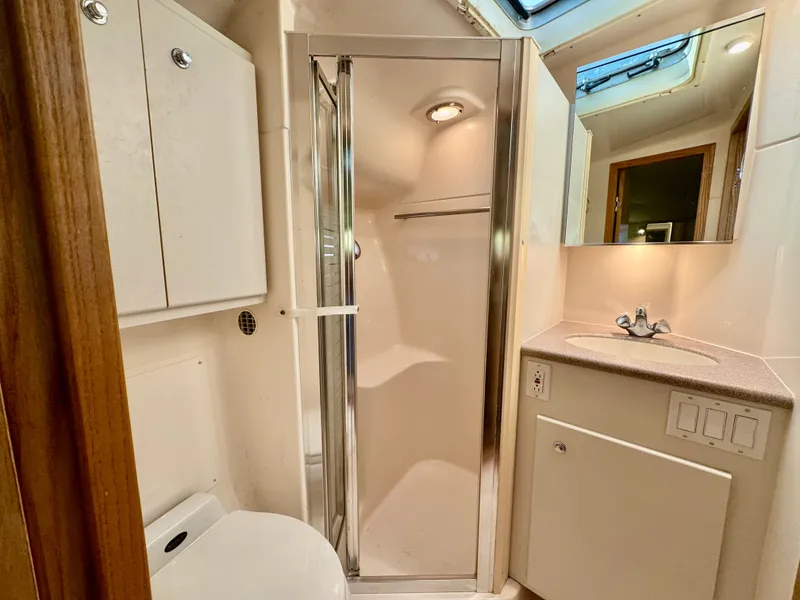 Slide: The Image of Tiara Yachts 4100 Open 1999 bathroom with shower and sink. - 45