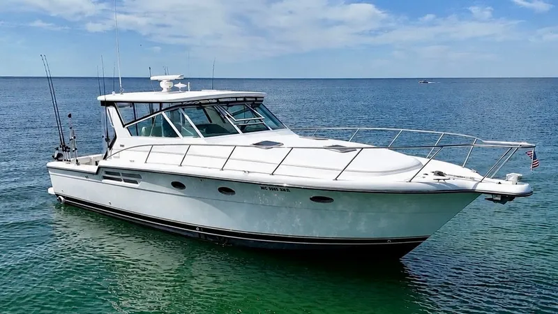 Slide: The Image of 1999 Tiara Yachts 4100 Open on calm sea. - 6