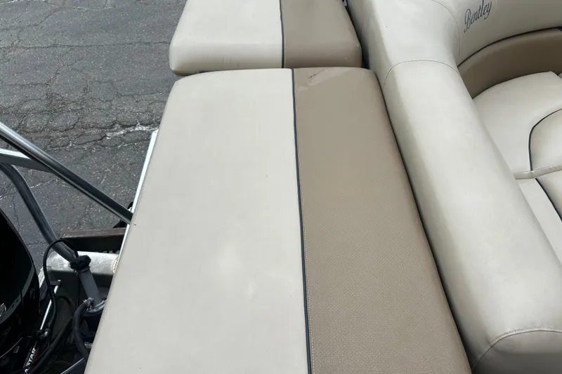 Slide: The Image of 2019 Bentley Pontoons 243 boat seating with beige upholstery and sleek design. - 15