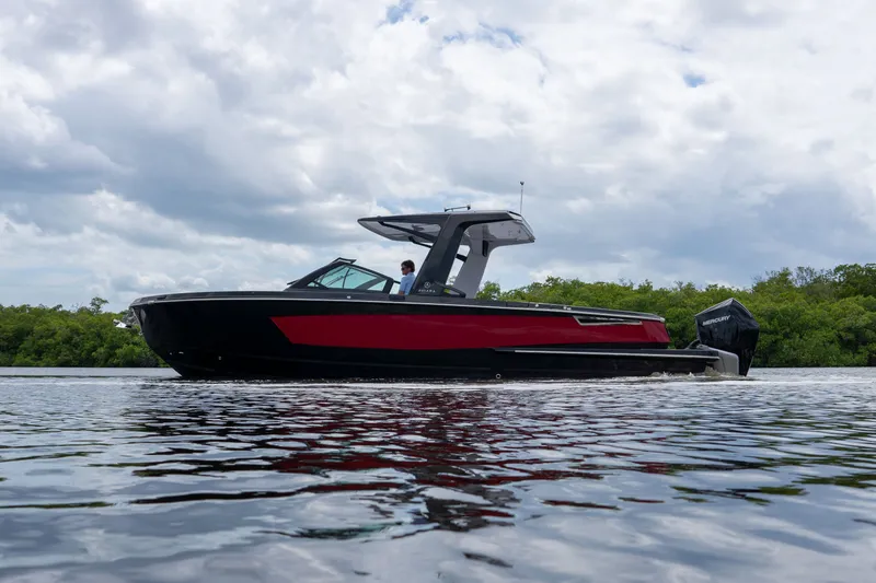 Slide: The Image of 2024 Aviara AV32 OB boat on calm water. - 21