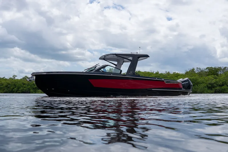Slide: The Image of 2024 Aviara AV32 OB boat on calm water. - 22