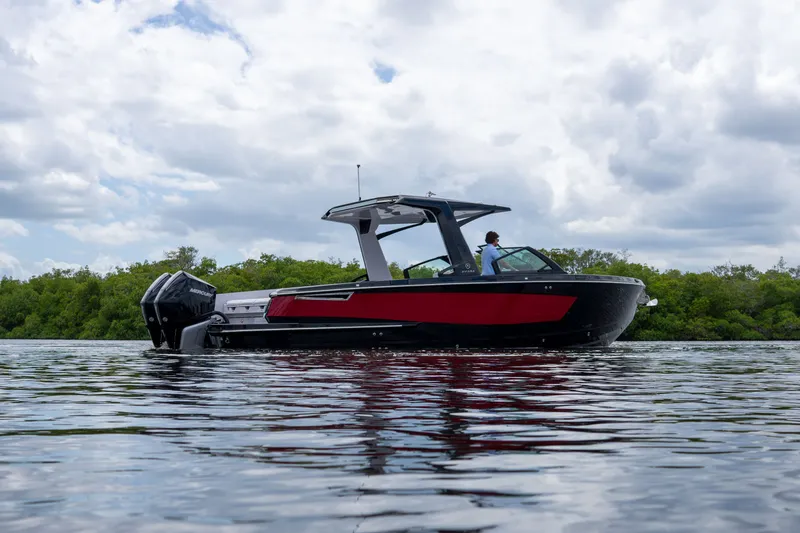 Slide: The Image of 2024 Aviara AV32 OB boat on calm water. - 28