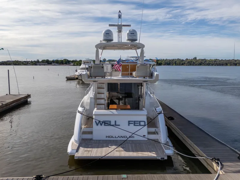 Slide: The Image of Azimut 50 Fly 2018 yacht docked with flag. - 15