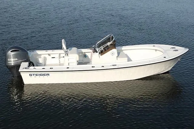 The Image of 2027 Steiger Craft 21 Classic boat on calm water, featuring a sleek white design. - 1