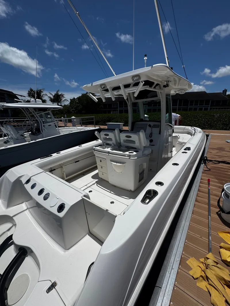 Slide: The Image of 2011 Boston Whaler 280 Outrage boat docked under sunny skies. - 12