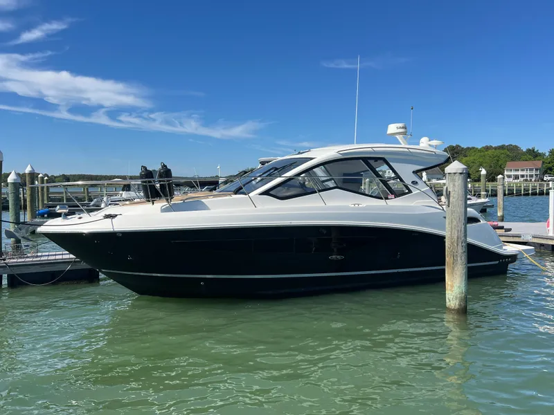 The Image of 2018 Sea Ray Sundancer 350 Coupe docked on a sunny day. - 0