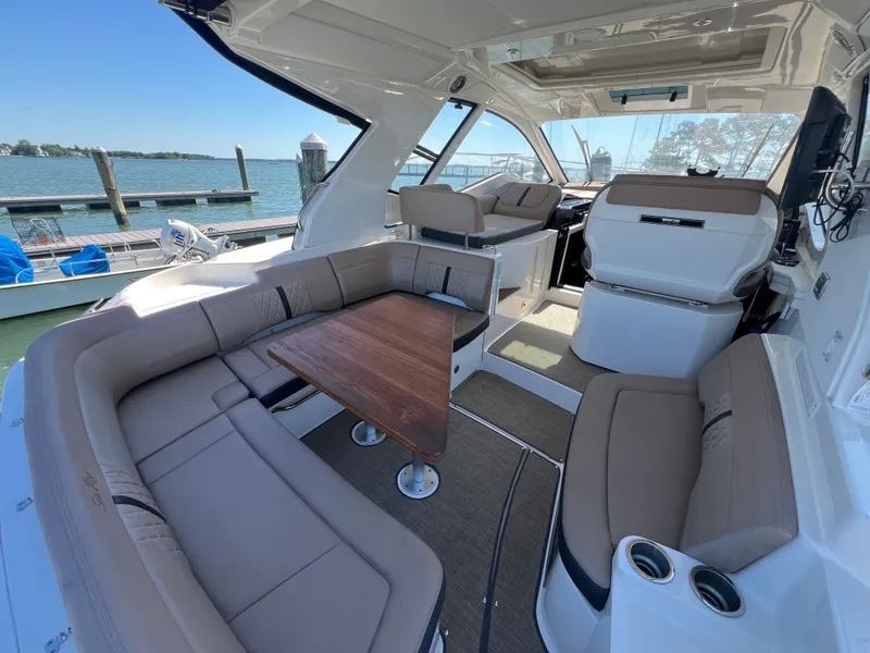 Slide: The Image of Interior of a 2018 Sea Ray Sundancer 350 Coupe yacht at the dock. - 12