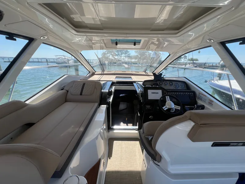 Slide: The Image of Interior of 2018 Sea Ray Sundancer 350 Coupe with helm station. - 18
