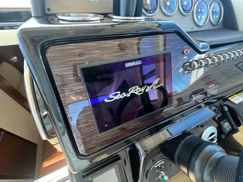 Slide: The Image of Dashboard of 2018 Sea Ray Sundancer 350 Coupe with Simrad display. - 2
