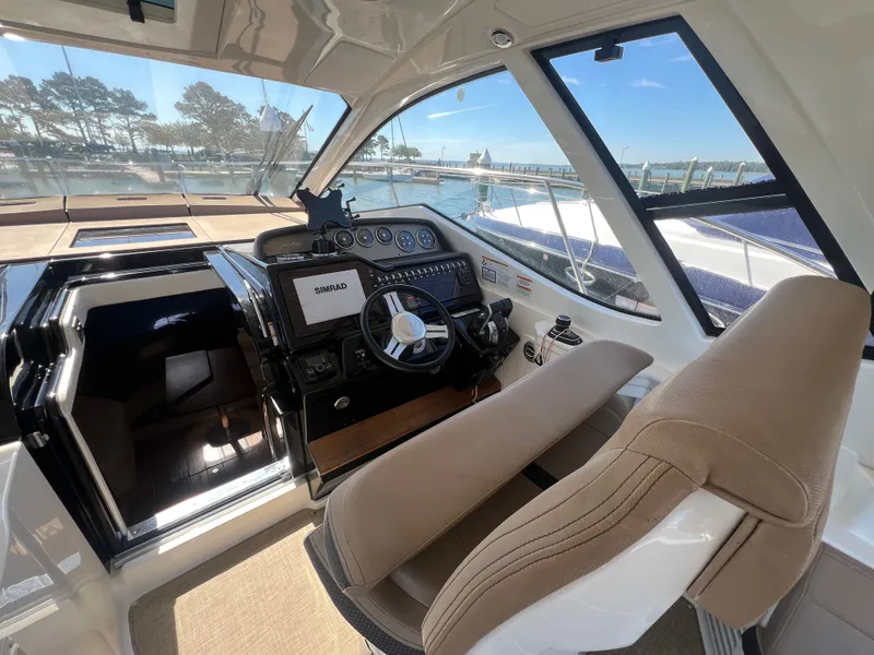 Slide: The Image of Interior of 2018 Sea Ray Sundancer 350 Coupe with helm station. - 20