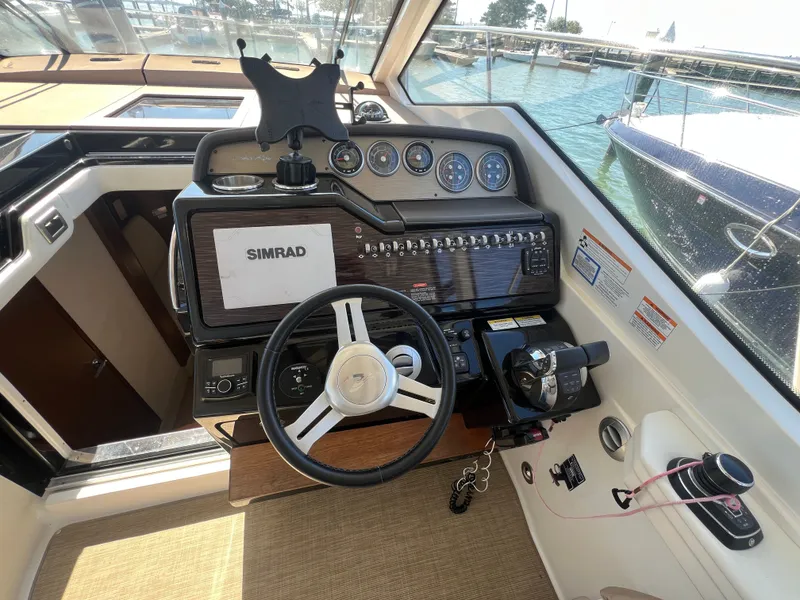 Slide: The Image of Cockpit of 2018 Sea Ray Sundancer 350 Coupe with Simrad controls. - 21