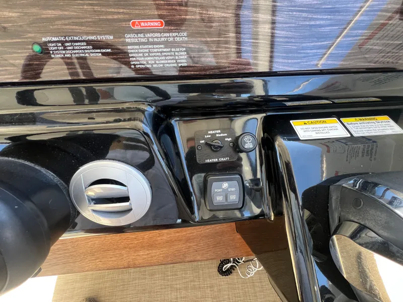 Slide: The Image of Dashboard of 2018 Sea Ray Sundancer 350 Coupe with heater controls. - 23