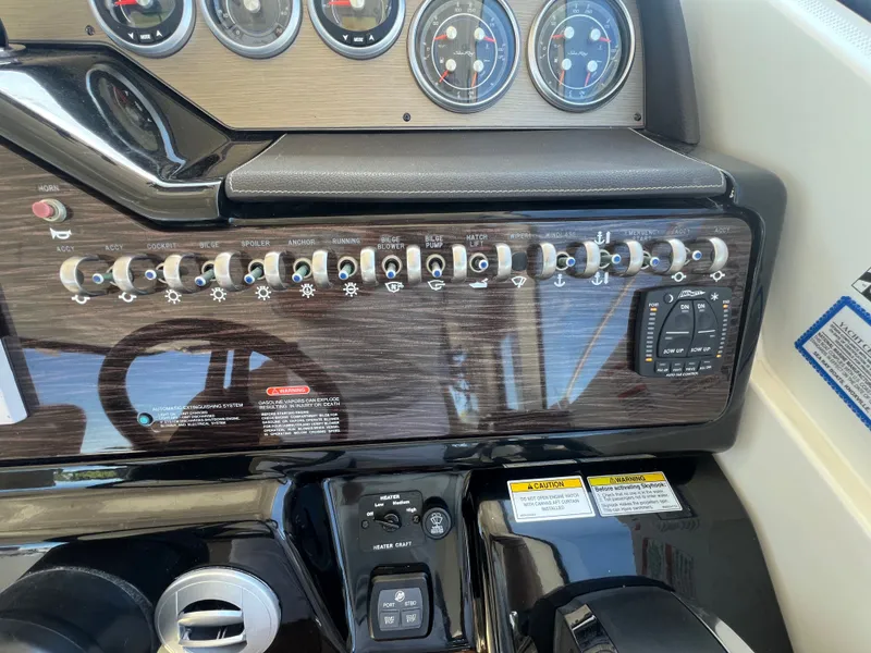 Slide: The Image of Dashboard of 2018 Sea Ray Sundancer 350 Coupe with switches and gauges. - 25