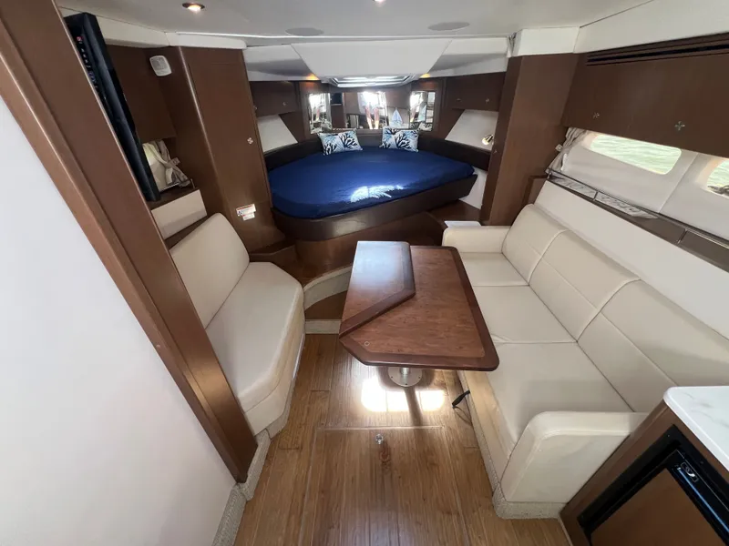 Slide: The Image of Interior of 2018 Sea Ray Sundancer 350 Coupe with sofa and table. - 26