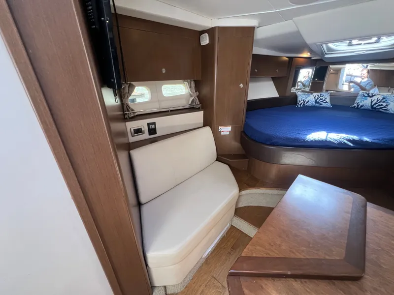 Slide: The Image of Interior of 2018 Sea Ray Sundancer 350 Coupe with bed and seating area. - 27