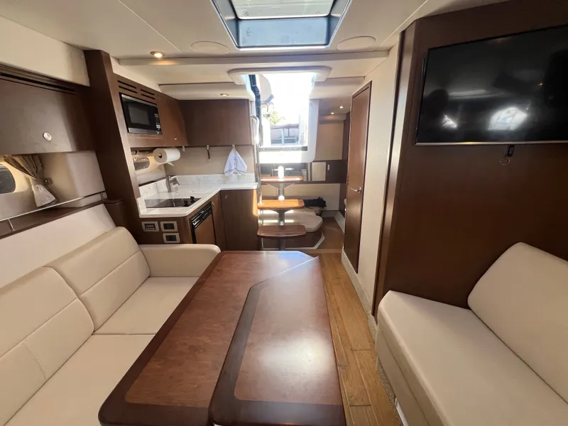 Slide: The Image of Interior of 2018 Sea Ray Sundancer 350 Coupe with modern amenities. - 34