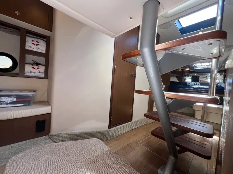 Slide: The Image of Interior of 2018 Sea Ray Sundancer 350 Coupe with wooden staircase. - 43