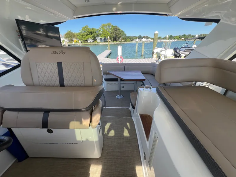 Slide: The Image of Interior of 2018 Sea Ray Sundancer 350 Coupe with seating and table. - 47