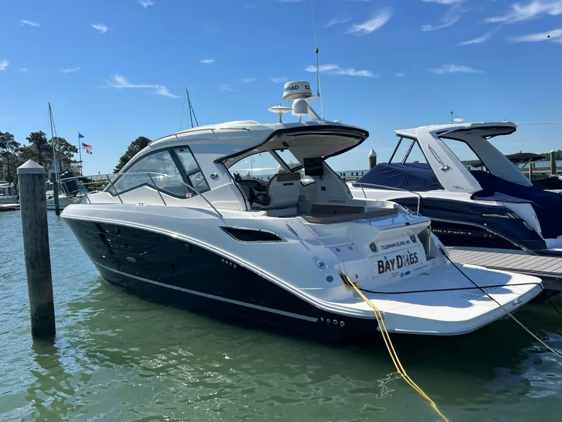 Slide: The Image of 2018 Sea Ray Sundancer 350 Coupe docked at marina. - 5