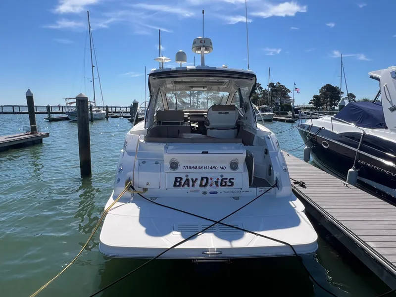 Slide: The Image of 2018 Sea Ray Sundancer 350 Coupe docked at marina. - 6