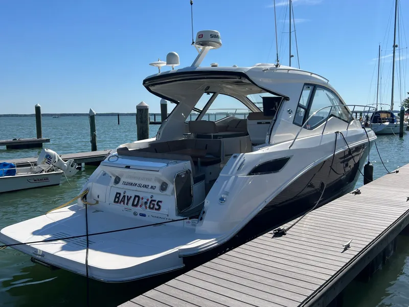 Slide: The Image of 2018 Sea Ray Sundancer 350 Coupe docked at marina. - 7
