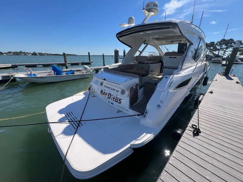 Slide: The Image of 2018 Sea Ray Sundancer 350 Coupe docked on a sunny day. - 8