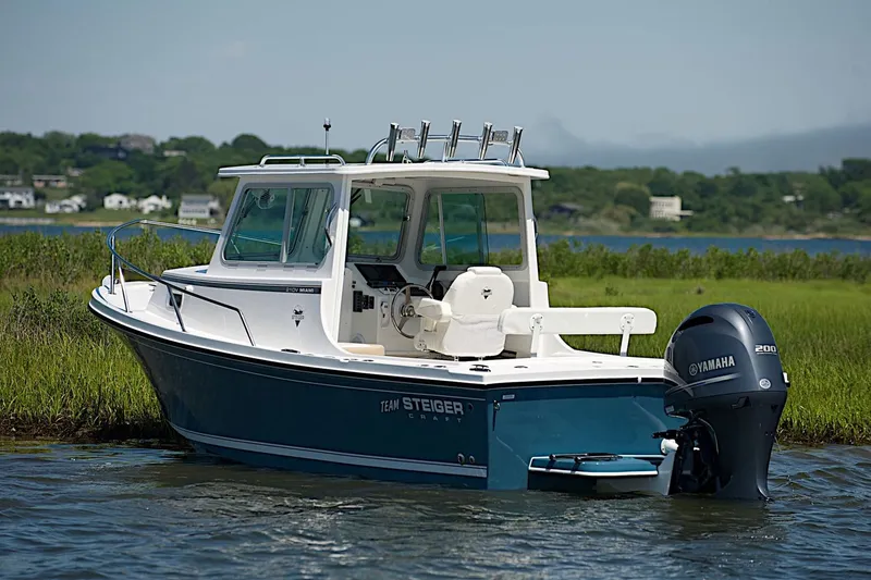 The Image of 2027 Steiger Craft 21 Miami boat with Yamaha engine on a scenic waterway. - 1