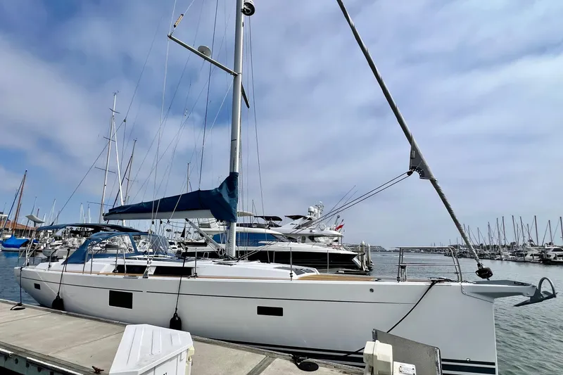 Slide: The Image of 2016 Hanse 455 sailboat docked at marina under a partly cloudy sky. - 10