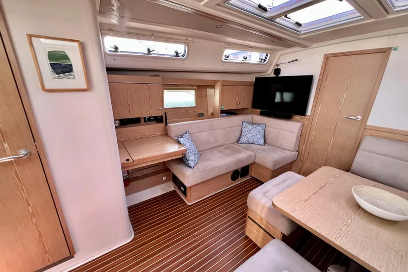 Slide: The Image of Luxurious interior of 2016 Hanse 455 yacht with modern seating and wooden finishes. - 103