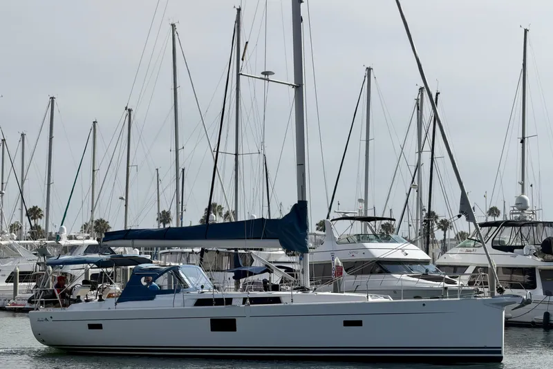 Slide: The Image of 2016 Hanse 455 sailboat docked in a marina with other yachts. - 11