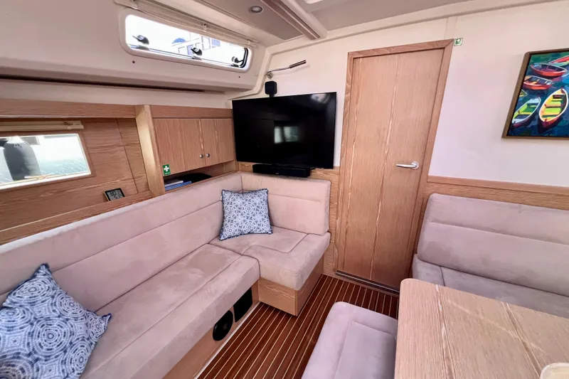 Slide: The Image of Interior of 2016 Hanse 455 yacht with cozy seating, TV, and nautical decor. - 119
