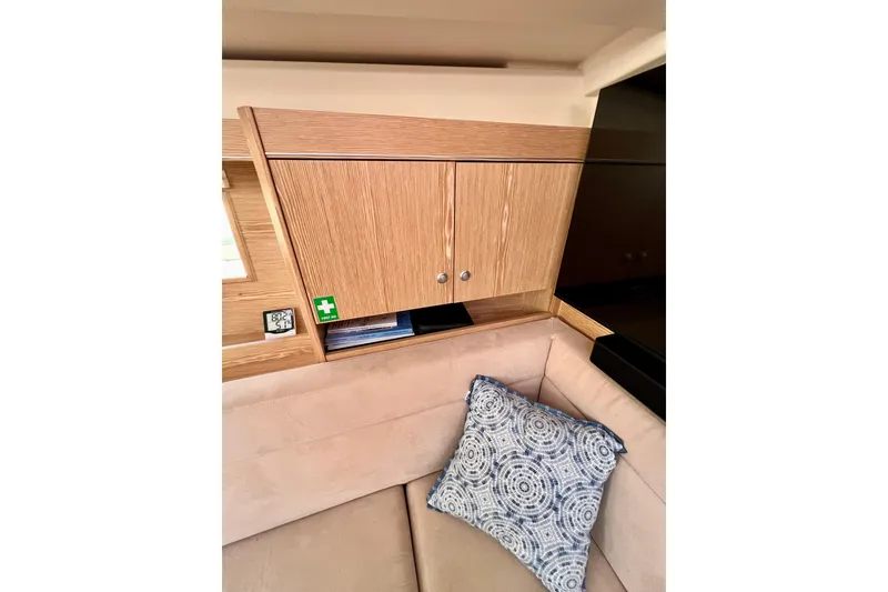 Slide: The Image of Interior of 2016 Hanse 455 yacht with wooden cabinetry and patterned cushion. - 120