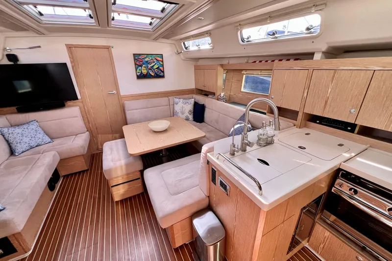 Slide: The Image of Luxurious interior of 2016 Hanse 455 yacht with modern kitchen and cozy seating area. - 123